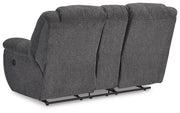 Ashley Furniture Foreside reclining loveseat with console, showing plush upholstery and built-in cup holders.