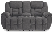 Ashley Furniture Foreside reclining loveseat with console, showing plush fabric and built-in cup holders from a front view.