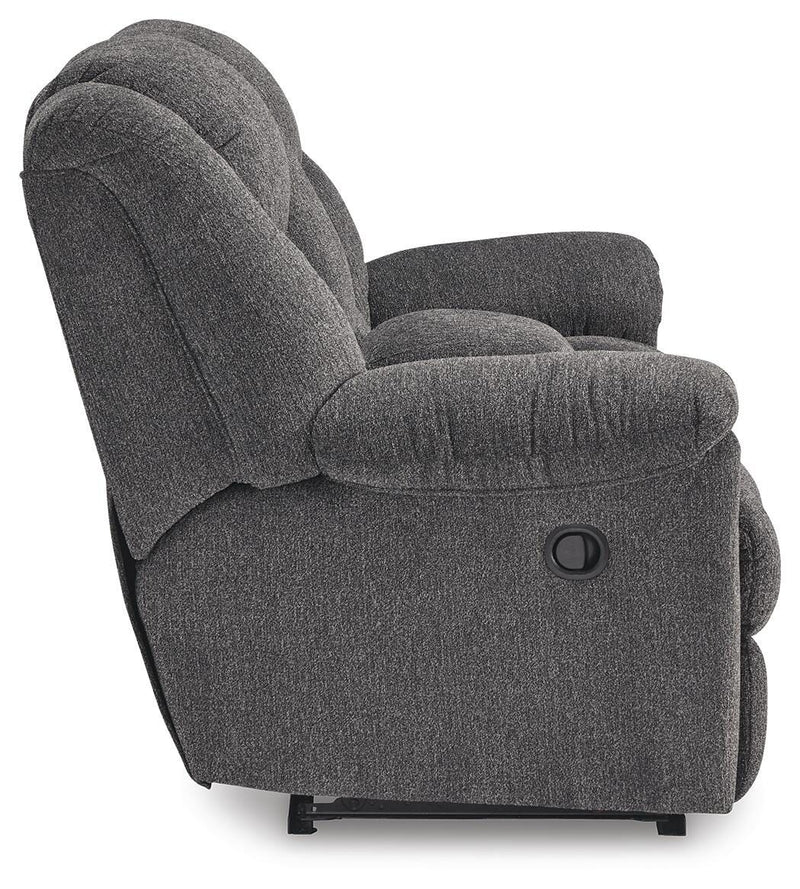 Ashley Furniture Foreside reclining loveseat with console, showing plush fabric, reclining mechanism, and built-in center console.