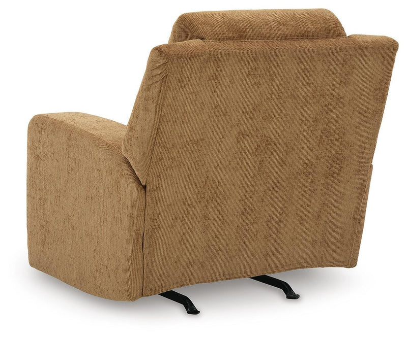 Ashley Furniture Kanlow recliner in beige fabric, showing plush backrest and armrests, designed for comfortable lounging.