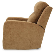 Ashley Furniture Kanlow recliner in beige fabric, showing plush padded armrests and a comfortable reclining position.