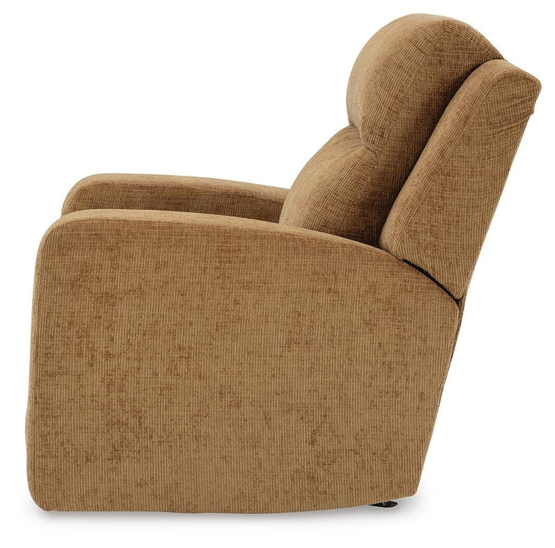 Ashley Furniture Kanlow recliner in beige fabric, showing plush padded armrests and a comfortable reclining position.