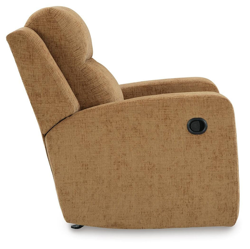 Ashley Furniture Kanlow recliner with plush fabric and cushioned armrests, shown from a side view in a living room setting.