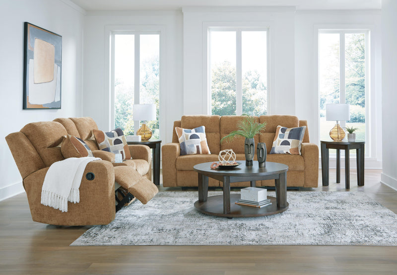 Ashley Furniture Kanlow living room set with sofa, loveseat, and armchair in neutral fabric, arranged in a modern living room setting.