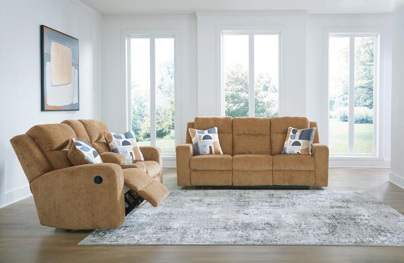 Ashley Furniture Kanlow living room set with sofa, loveseat, and armchair in neutral upholstery arranged in a cozy living space.
