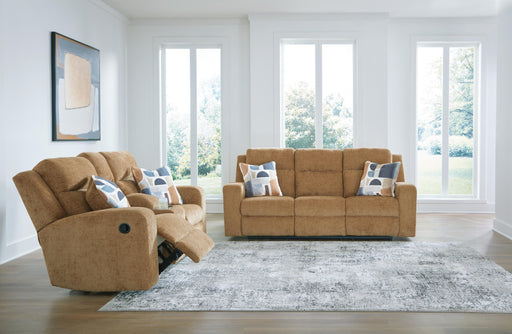 Ashley Furniture Kanlow living room set with sofa, loveseat, and armchair in neutral upholstery arranged in a cozy living space.