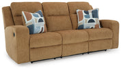 Ashley Furniture Kanlow reclining sofa shown from an angle, featuring plush cushions and a modern design in a cozy living room setting.