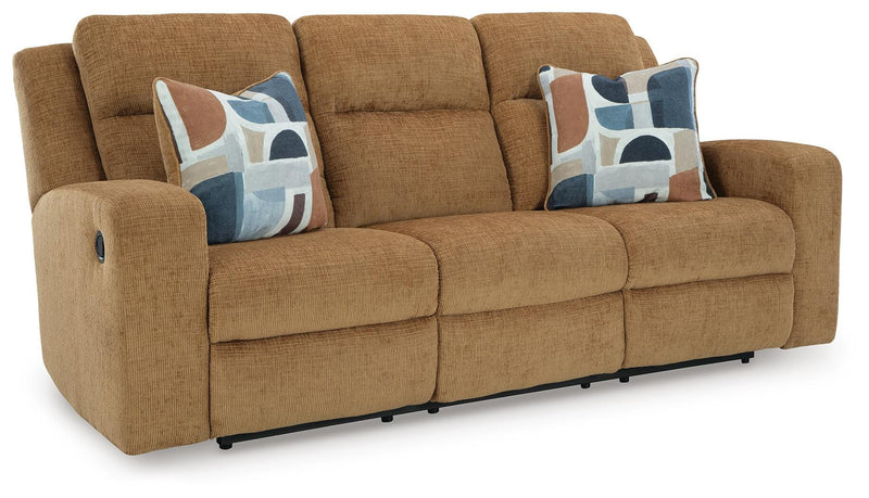 Ashley Furniture Kanlow reclining sofa shown from an angle, featuring plush cushions and a modern design in a cozy living room setting.