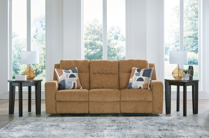Ashley Furniture Kanlow reclining sofa with plush cushions and fabric upholstery, shown with closed reclining feature.
