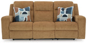 Ashley Furniture Kanlow reclining sofa with plush cushions and fabric upholstery, shown from the head-on angle.