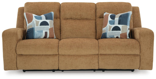 Ashley Furniture Kanlow reclining sofa with plush cushions and fabric upholstery, shown from the head-on angle.