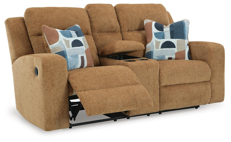 Ashley Furniture Kanlow reclining loveseat with console, shown from an open angle highlighting plush fabric and built-in cup holders.