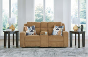 Ashley Furniture Kanlow reclining loveseat with built-in console, plush upholstery, and cushioned armrests for comfortable seating