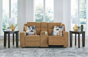 Ashley Furniture Kanlow reclining loveseat with console, showing open position, plush fabric, and built-in cup holders for comfort.