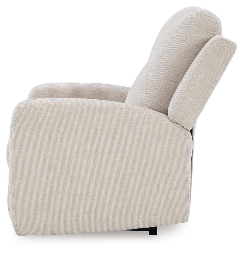 Ashley Furniture Danum Recliner in beige fabric with plush cushions and wooden legs, shown from a side angle.