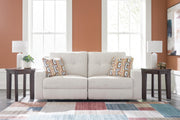 Ashley Furniture Danum Reclining Sofa in dark fabric, showing plush cushions and reclining features in a cozy living room setting.