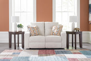 Ashley Furniture Danum reclining loveseat with plush fabric, padded armrests, and built-in recline mechanism for comfort.