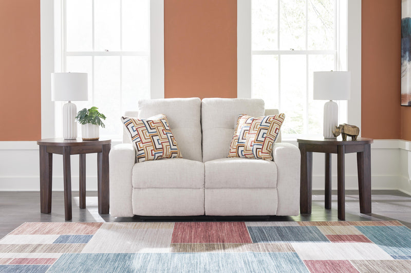 Ashley Furniture Danum reclining loveseat with plush fabric, padded armrests, and built-in recline mechanism for comfort.