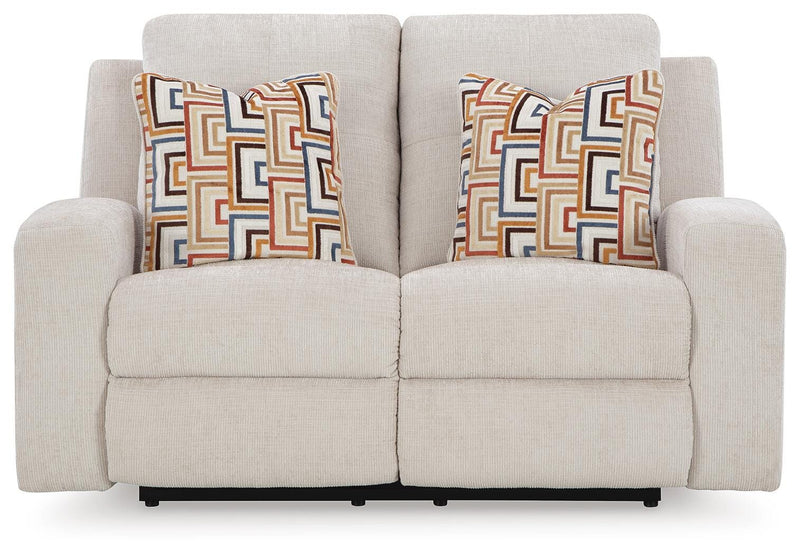 Ashley Furniture Danum Reclining Loveseat, shown head-on with plush upholstery and reclining features in a modern living room setting.