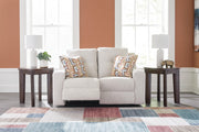 Ashley Furniture Danum reclining loveseat with plush fabric and built-in recliners, open position showing comfortable seating.