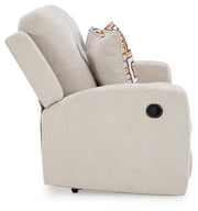 Ashley Furniture Danum reclining loveseat with plush fabric upholstery and padded armrests, shown in a cozy living room setting.
