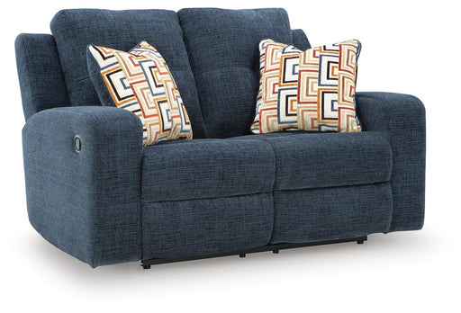 Ashley Furniture Danum reclining loveseat with plush cushions and armrests, shown in a closed position from an angled view.