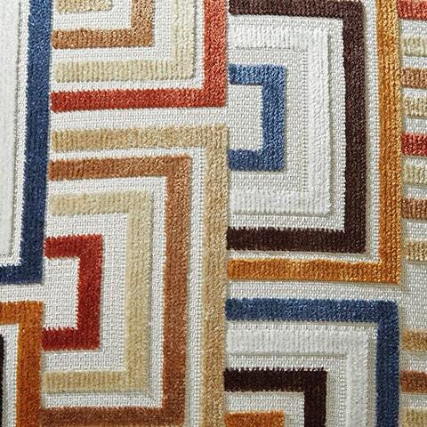 Ashley Furniture Danum Reclining Sofa with plush cushions and neutral fabric, showing a close-up of the pillow swatch.