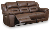 Ashley Furniture Stoneland living room set with sofa and armchair in a modern design, shown from an angled side view.