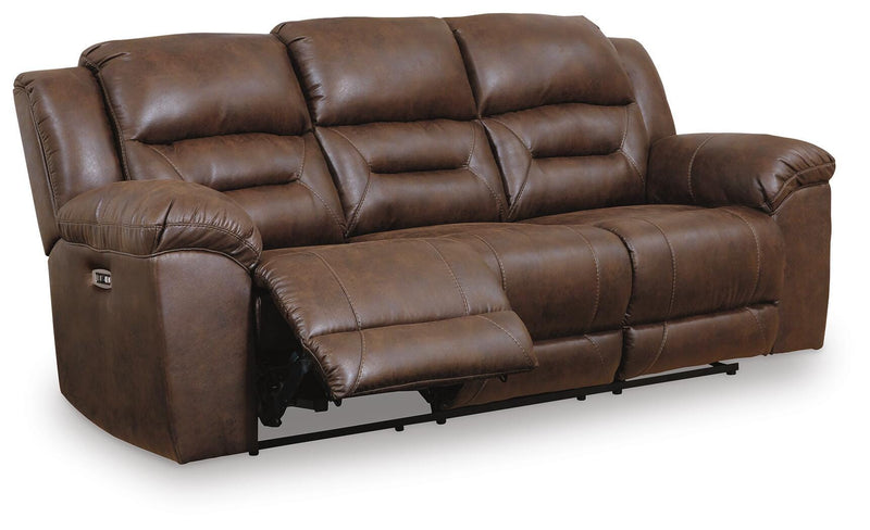 Ashley Furniture Stoneland living room set with sofa and armchair in a modern design, shown from an angled side view.