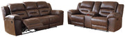 Ashley Furniture Stoneland living room set with sofa, loveseat, and coffee table arranged in a modern, stylish living space.