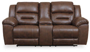 Ashley Furniture Stoneland living room set with sofa and loveseat in a modern design, featuring neutral fabric upholstery and stylish cushions.