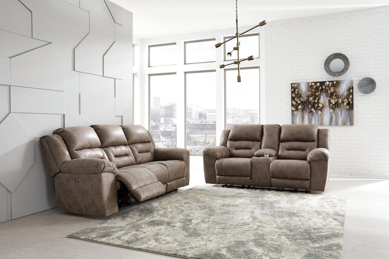 Ashley Furniture Stoneland living room set with sofa and armchair, featuring neutral fabric and modern design.