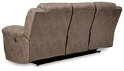 Ashley Furniture Stoneland living room set with sofa and armchair, featuring neutral fabric and wooden legs.