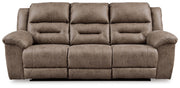 Ashley Furniture Stoneland living room set with sofa and armchair in a modern design, shown in a cozy living space.