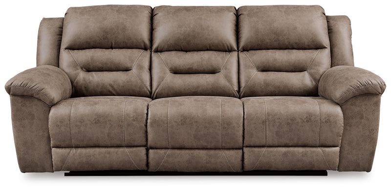 Ashley Furniture Stoneland living room set with sofa and armchair in a modern design, shown in a cozy living space.