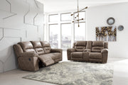 Ashley Furniture Stoneland living room set with sofa and armchair, in a modern design with neutral upholstery.