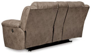 Ashley Furniture Stoneland living room set with a sofa and armchair, featuring neutral upholstery and modern design.
