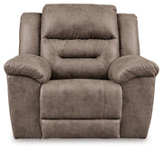Ashley Furniture Stoneland living room set with sofa and armchair in a modern design, shown from the front in a well-lit room.