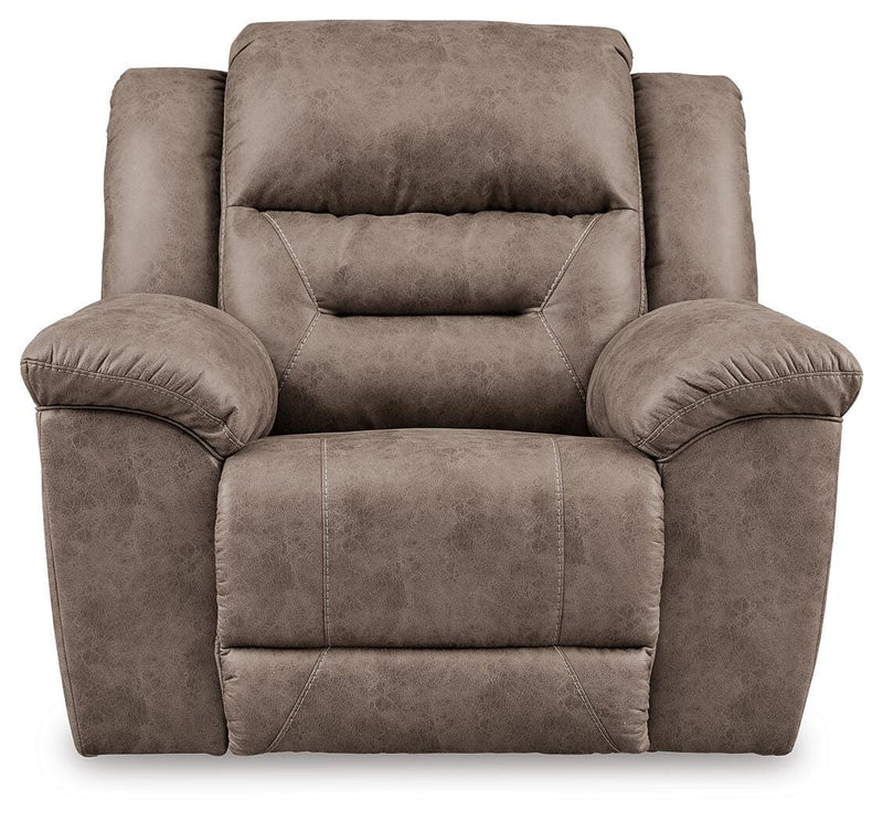 Ashley Furniture Stoneland living room set with sofa and armchair in a modern design, shown from the front in a well-lit room.
