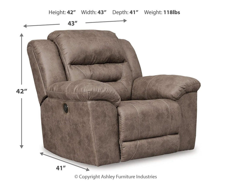 Ashley Furniture Stoneland living room set with sofa and armchair in a modern fabric, arranged in a cozy home setting
