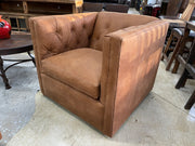 Leather swivel accent chair with tufted design in beige fabric, featuring a rounded back and wooden base by Mayo Furniture.