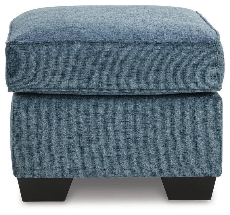 Ashley Furniture Cashton living room set featuring a sofa and loveseat with neutral fabric upholstery and modern design.