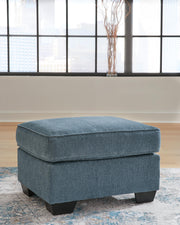 Ashley Furniture Cashton living room set with sofa and loveseat featuring neutral upholstery and modern design.