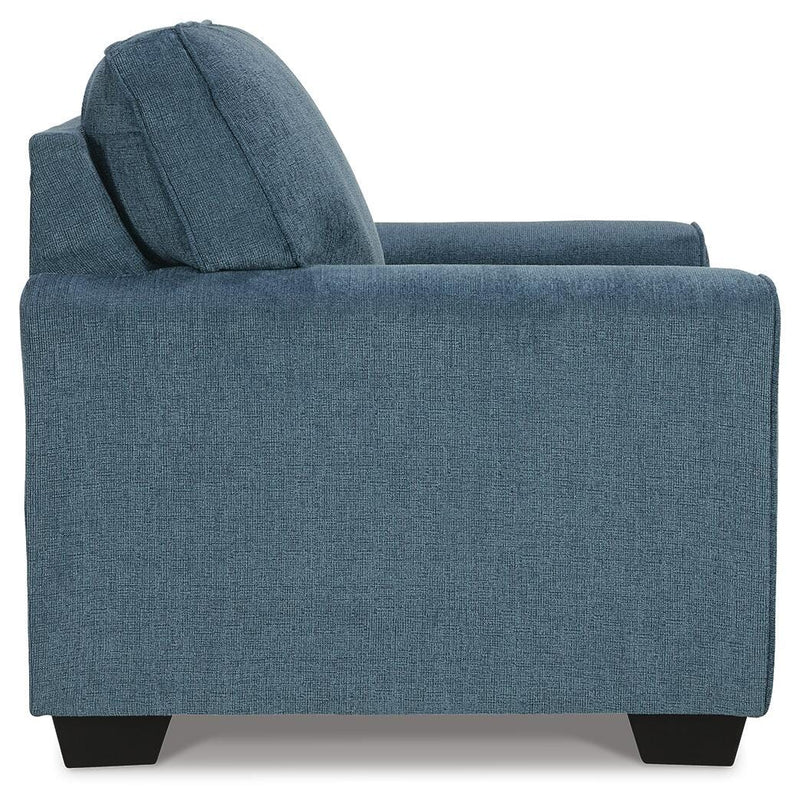 Ashley Furniture Cashton living room set with sofa and armchair in a cozy, modern design, shown in a stylish living room setup.
