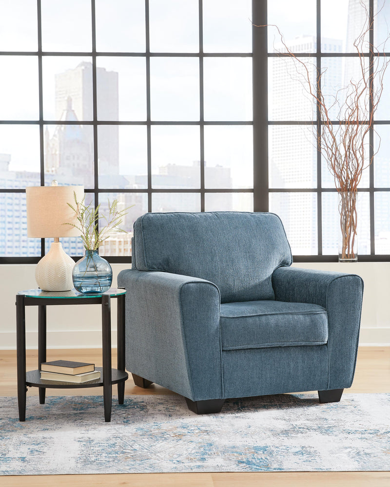 Ashley Furniture Cashton Chair with upholstered fabric, wooden legs, and a modern design, shown in a cozy living room setting.