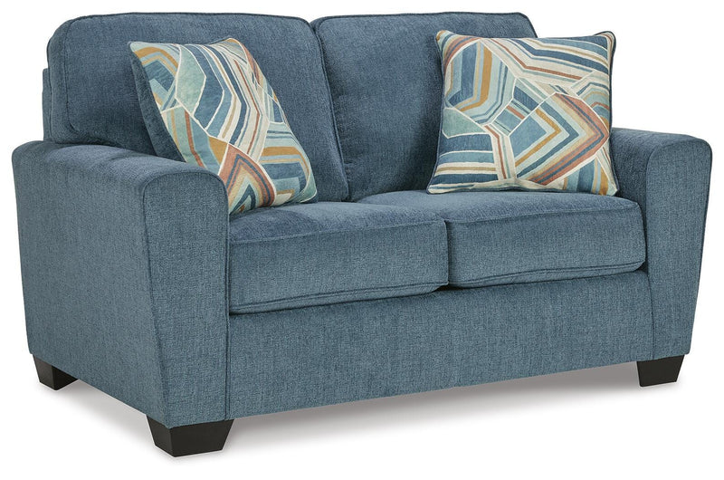 Ashley Furniture Cashton living room set featuring a sectional sofa with plush cushions and modern design in neutral fabric.