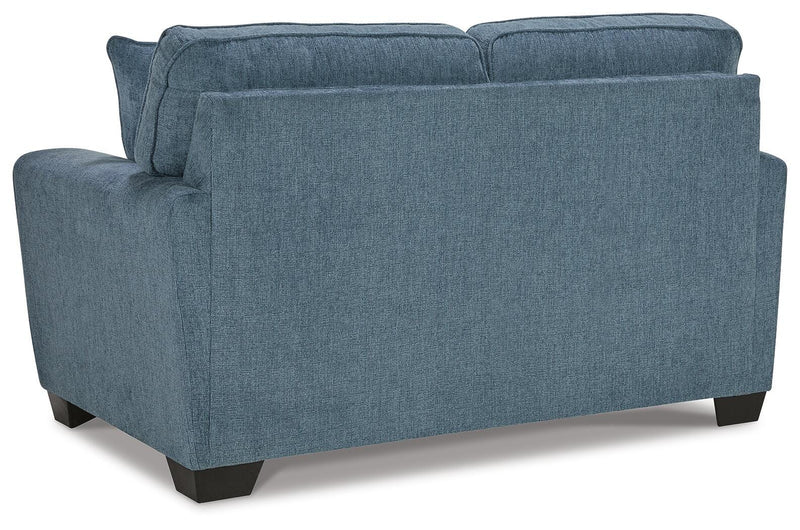 Ashley Furniture Cashton living room set with sectional sofa, featuring plush cushions and neutral fabric upholstery.