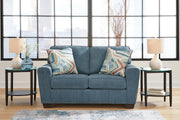 Ashley Furniture Cashton living room set featuring a sofa and loveseat with plush cushions and modern design in a cozy living space.
