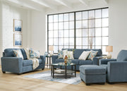 Ashley Furniture Cashton living room set with sofa and armchair in a modern design, shown in a cozy, well-lit living room setting.