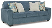 Ashley Furniture Cashton living room set with a sofa and loveseat in a modern design, shown from an angled perspective.
